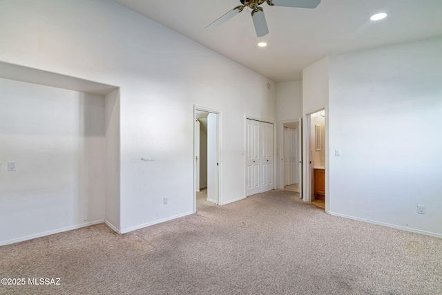 3748 N Sabino Ridge Pl, Tucson, AZ 85750 - unfurnished bedroom with light carpet, recessed lighting, baseboards, connected bathroom, and ceiling fan