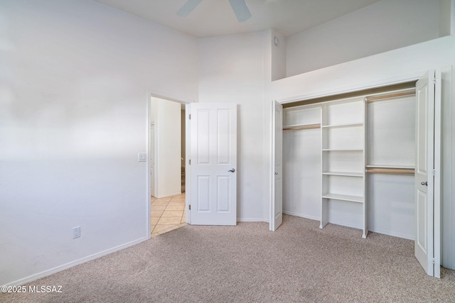 3748 N Sabino Ridge Pl, Tucson, AZ 85750 - unfurnished bedroom with carpet floors, baseboards, a closet, and a ceiling fan