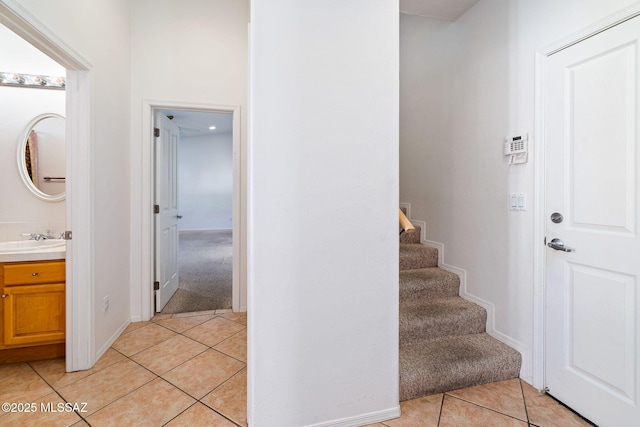 3748 N Sabino Ridge Pl, Tucson, AZ 85750 - staircase featuring tile patterned flooring, carpet floors, and baseboards