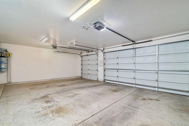 3748 N Sabino Ridge Pl, Tucson, AZ 85750 - garage with a garage door opener and a central vacuum unit