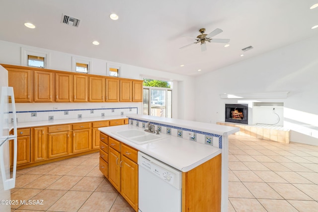3748 N Sabino Ridge Pl, Tucson, AZ 85750 - kitchen featuring white appliances, a sink, light countertops, light tile patterned floors, and recessed lighting