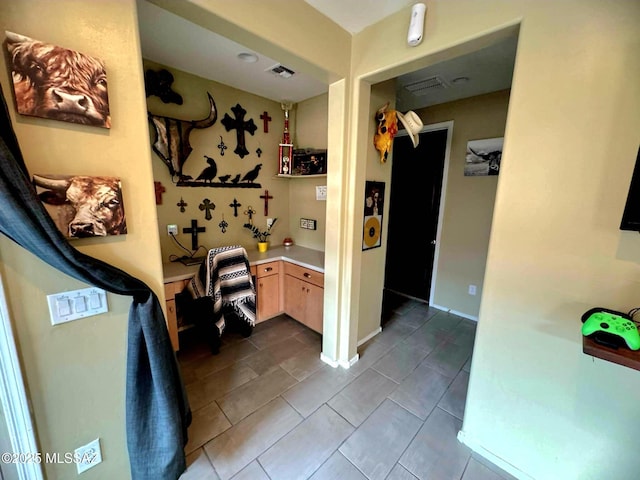 6515 E Vuelta Tierra Blanca, Tucson, AZ 85756 - hallway featuring dark tile patterned flooring