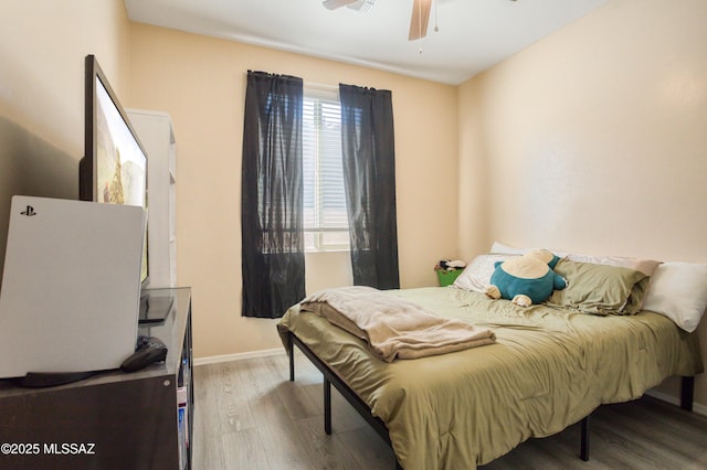 6515 E Vuelta Tierra Blanca, Tucson, AZ 85756 - bedroom with wood finished floors, baseboards, and a ceiling fan