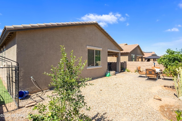 6515 E Vuelta Tierra Blanca, Tucson, AZ 85756 - back of house with stucco siding and a patio area