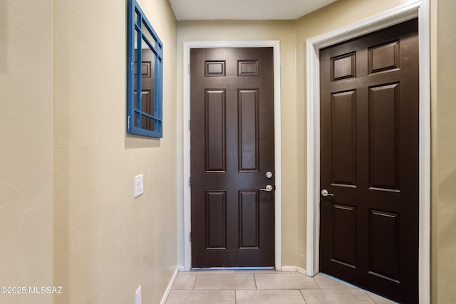 6515 E Vuelta Tierra Blanca, Tucson, AZ 85756 - doorway featuring baseboards and light tile patterned floors