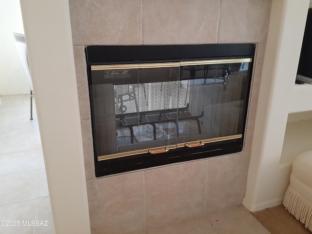 details featuring a tile fireplace