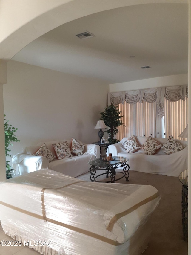living room featuring visible vents