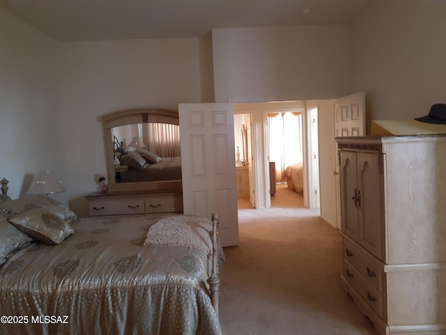 bedroom featuring light carpet