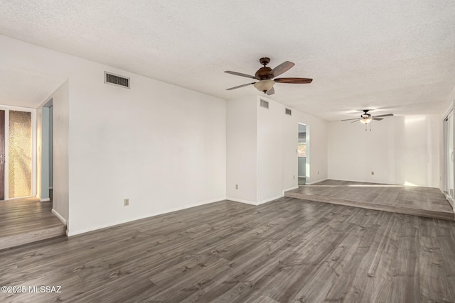 1363 W Dawn Dr, Tucson, AZ 85704 - unfurnished living room featuring a ceiling fan, dark wood-style flooring, and a textured ceiling