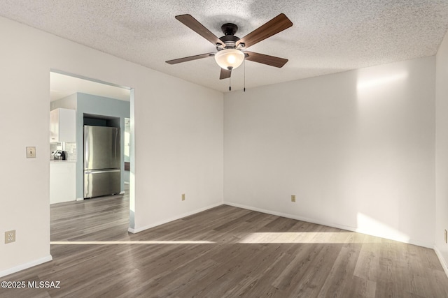 1363 W Dawn Dr, Tucson, AZ 85704 - unfurnished room featuring wood finished floors, ceiling fan, baseboards, and a textured ceiling
