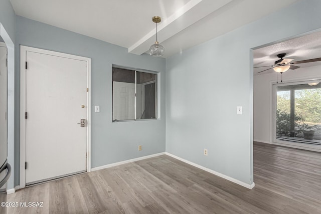 1363 W Dawn Dr, Tucson, AZ 85704 - spare room with wood finished floors, baseboards, and ceiling fan