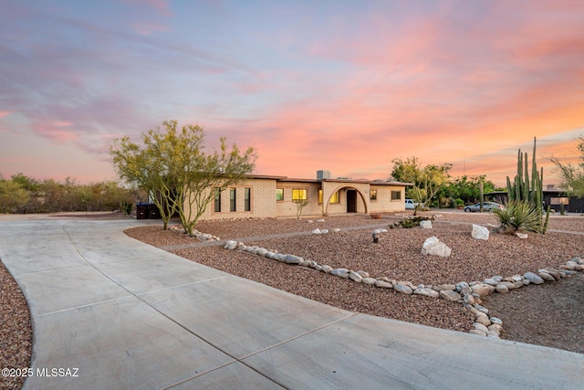 1363 W Dawn Dr, Tucson, AZ 85704 - ranch-style house with concrete driveway and brick siding