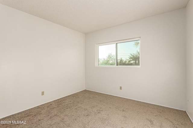 1363 W Dawn Dr, Tucson, AZ 85704 - empty room featuring carpet floors and baseboards