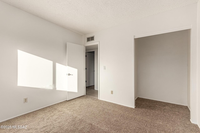 1363 W Dawn Dr, Tucson, AZ 85704 - empty room featuring carpet flooring and a textured ceiling