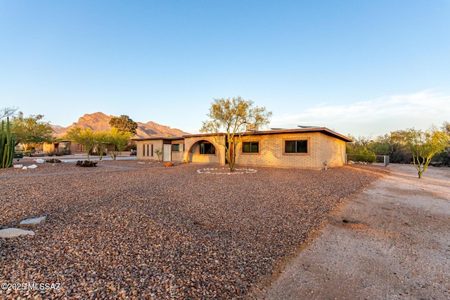 1363 W Dawn Dr, Tucson, AZ 85704 - view of front of property with brick siding and a mountain view