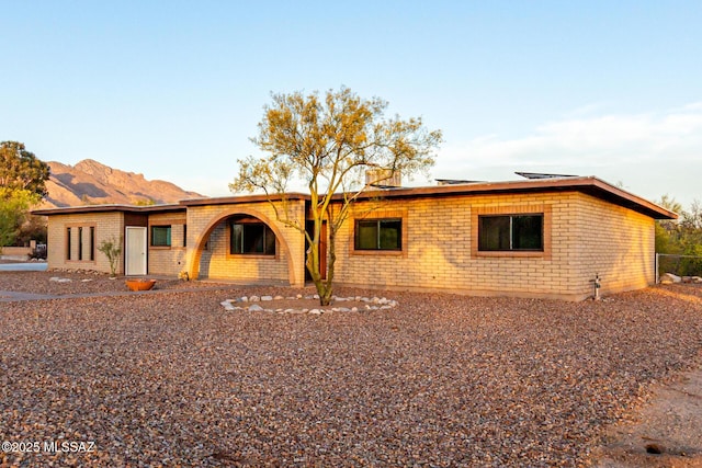 1363 W Dawn Dr, Tucson, AZ 85704 - view of front facade with brick siding and a mountain view