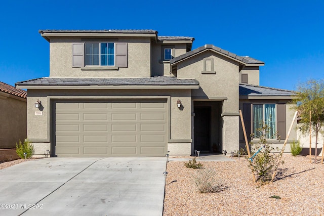 traditional-style home featuring stucco siding, an attached garage, and concrete driveway