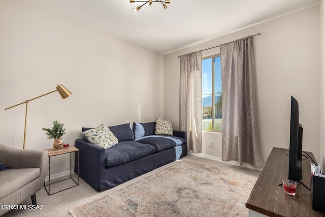 carpeted living area with baseboards