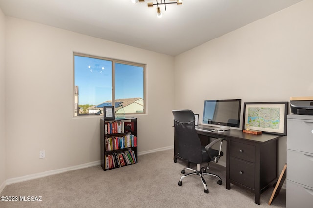 carpeted office space with baseboards