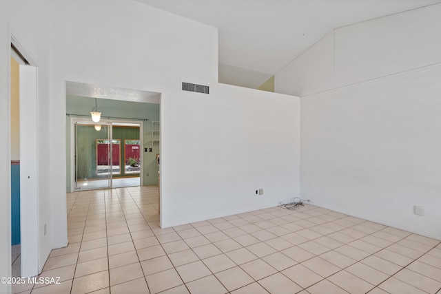 2991 W Basil Pl, Tucson, AZ 85741 - empty room with light tile patterned flooring and high vaulted ceiling