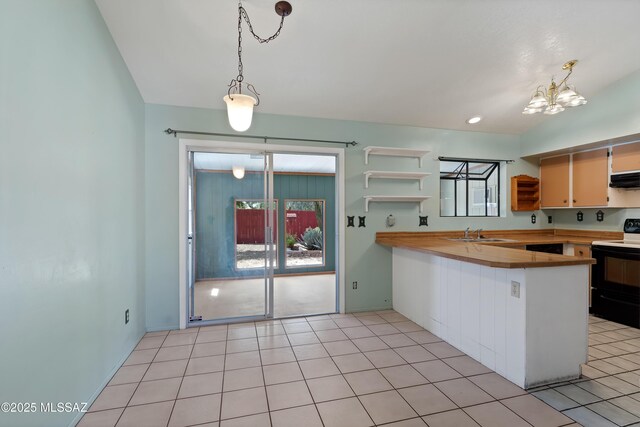 2991 W Basil Pl, Tucson, AZ 85741 - kitchen with white fridge with ice dispenser, light tile patterned flooring, and light countertops