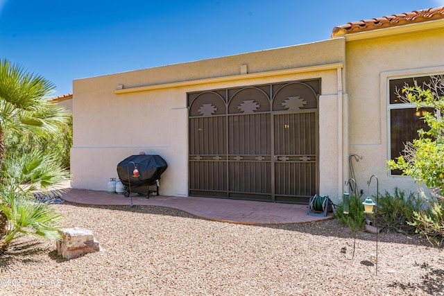 14227 N Willow Bend Dr, Oro Valley, AZ 85755 - view of exterior entry with stucco siding