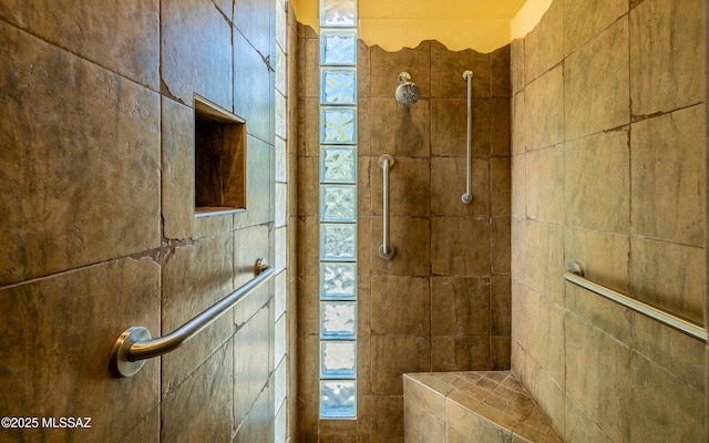 full bath featuring a tile shower