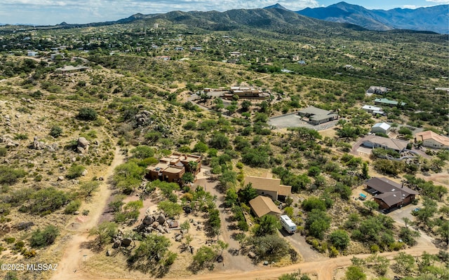 birds eye view of property with a mountain view