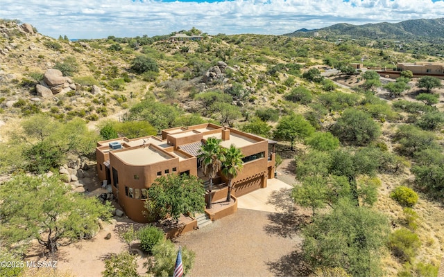 drone / aerial view featuring a mountain view