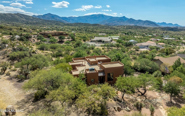 birds eye view of property with a mountain view