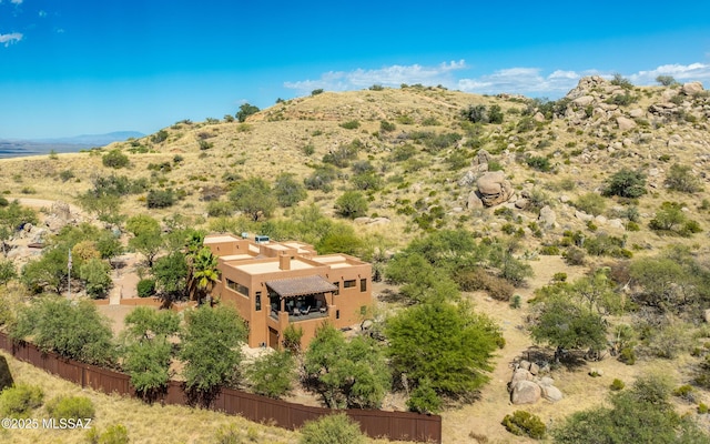 birds eye view of property featuring a mountain view