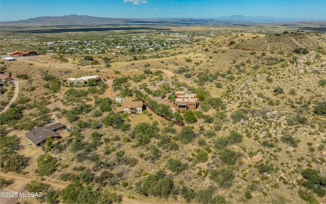 aerial view with a rural view, a mountain view, and a desert view