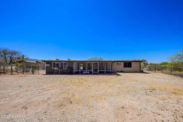 10575 E Placita Diego, Tucson, AZ 85748 - rear view of house featuring a sunroom, a fenced backyard, and brick siding