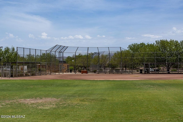 view of home's community with fence and a lawn