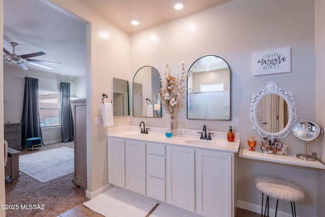 full bathroom with recessed lighting, a ceiling fan, double vanity, and a sink