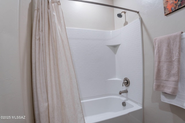 bathroom with shower / bath combination with curtain