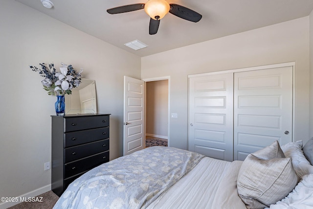 bedroom featuring carpet flooring, visible vents, a closet, baseboards, and a ceiling fan