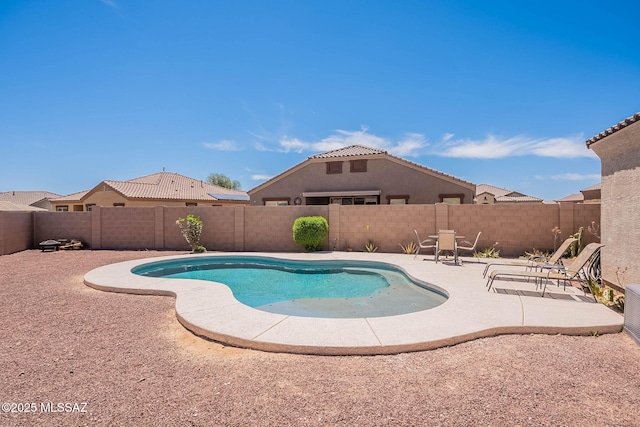 view of pool with a patio, a fenced in pool, and a fenced backyard