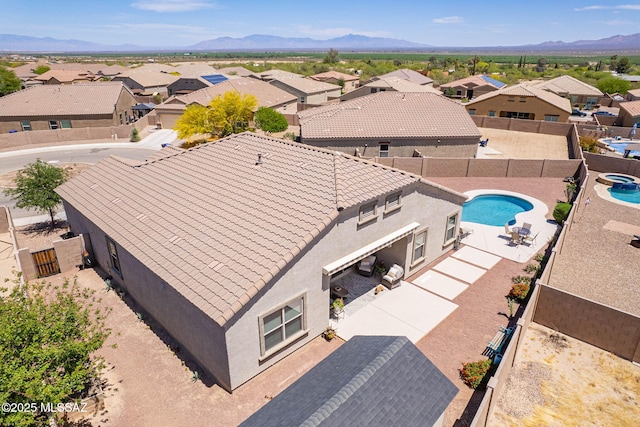 drone / aerial view featuring a mountain view and a residential view