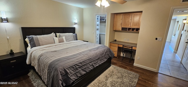 6651 N Campbell Ave Apt 152, Tucson, AZ 85718 - bedroom featuring dark wood finished floors, baseboards, a walk in closet, and ceiling fan
