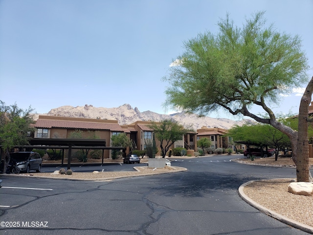 6651 N Campbell Ave Apt 152, Tucson, AZ 85718 - view of front of property with a mountain view, covered parking, and stucco siding