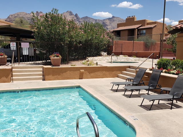 6651 N Campbell Ave Apt 152, Tucson, AZ 85718 - community pool featuring a mountain view and a patio area