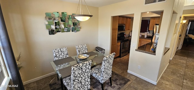 6651 N Campbell Ave Apt 152, Tucson, AZ 85718 - dining space with baseboards