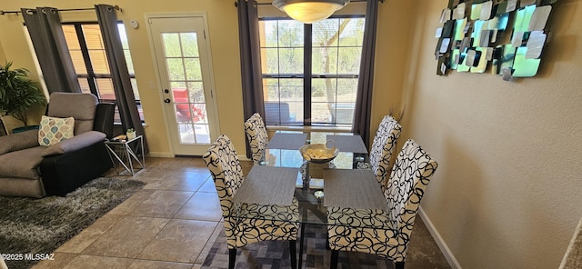 6651 N Campbell Ave Apt 152, Tucson, AZ 85718 - dining room featuring baseboards and tile patterned flooring