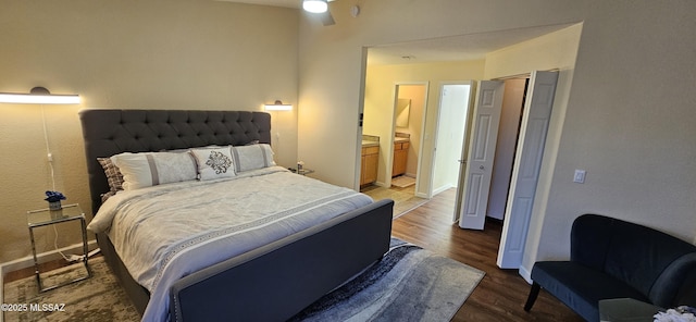 6651 N Campbell Ave Apt 152, Tucson, AZ 85718 - bedroom with wood finished floors, connected bathroom, and baseboards