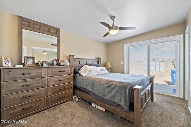 carpeted bedroom featuring access to outside and a ceiling fan