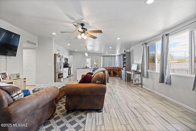 living room featuring light wood finished floors, recessed lighting, a ceiling fan, baseboards, and visible vents
