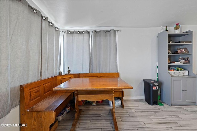 dining space with wood tiled floor