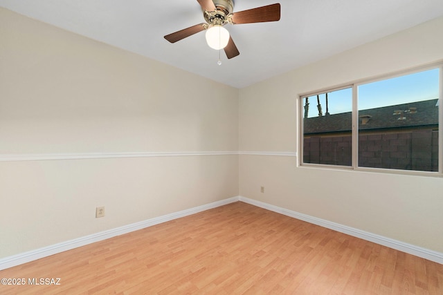 unfurnished room featuring light wood finished floors, ceiling fan, and baseboards