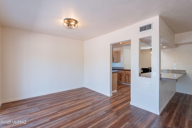 912 S Las Lomas Cir, Green Valley, AZ 85614 - interior space with visible vents, ceiling fan, dark wood finished floors, and baseboards